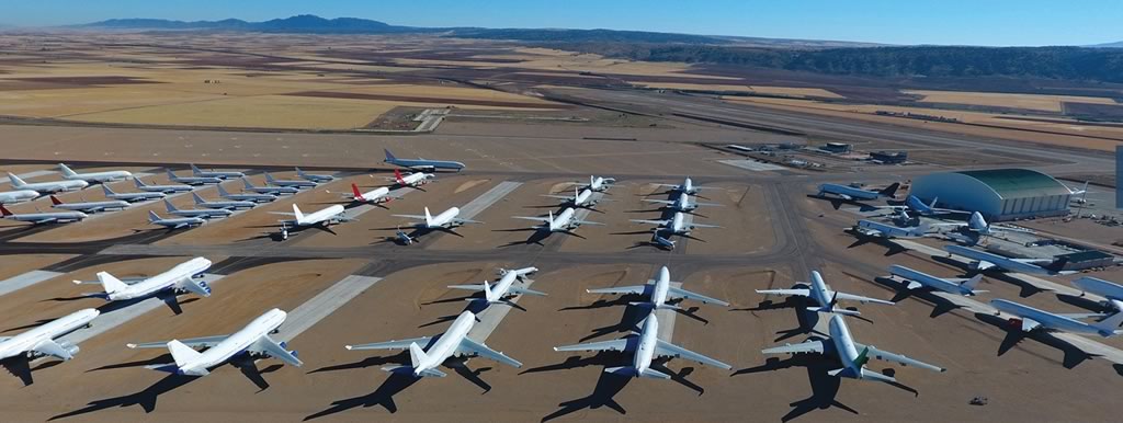Overhead view of dozens of airliners parked at the TARMAC Aerosave facility at the Teruel Airport